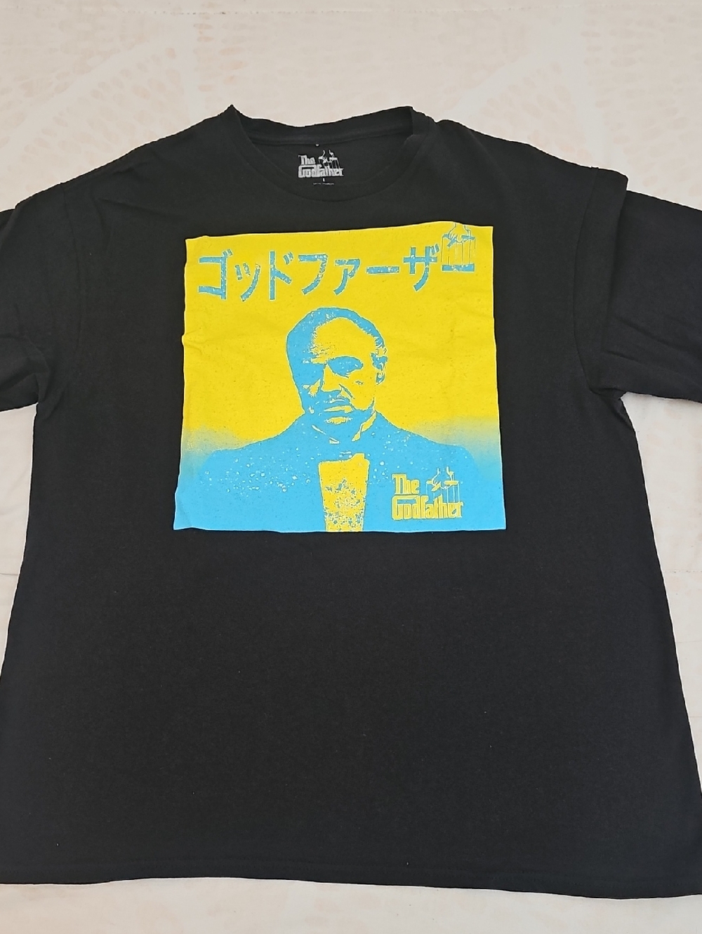 The Godfather Black Short Sleeve Tee with Yellow & Blue Graphic